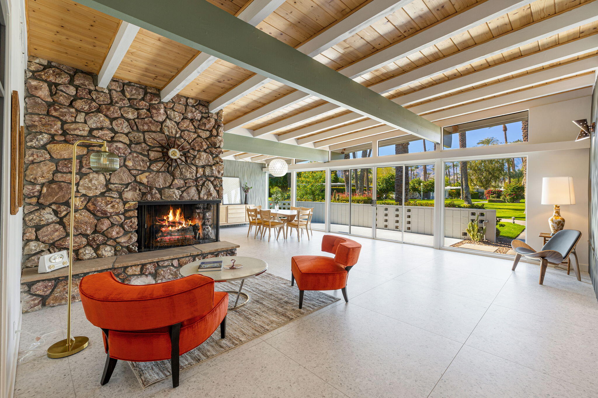 36903 Palm View Road Rancho Mirage, CA 92270 - Photo 56 of 58 a living room with furniture a fireplace and a floor to ceiling window