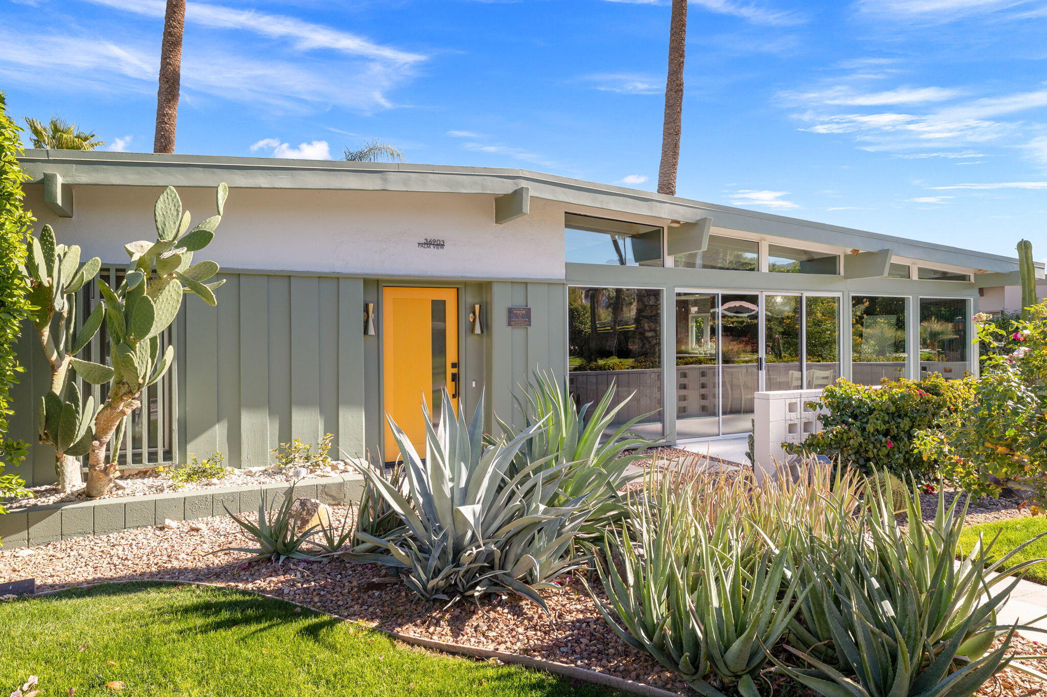 36903 Palm View Road Rancho Mirage, CA 92270 - Photo 58 of 58 a front view of a house with garden