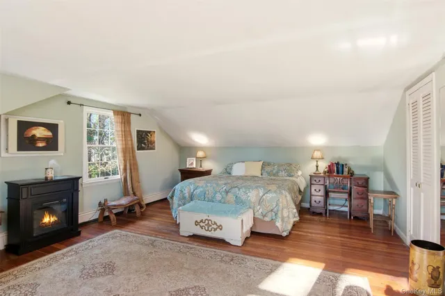 a bedroom with a bed and furniture