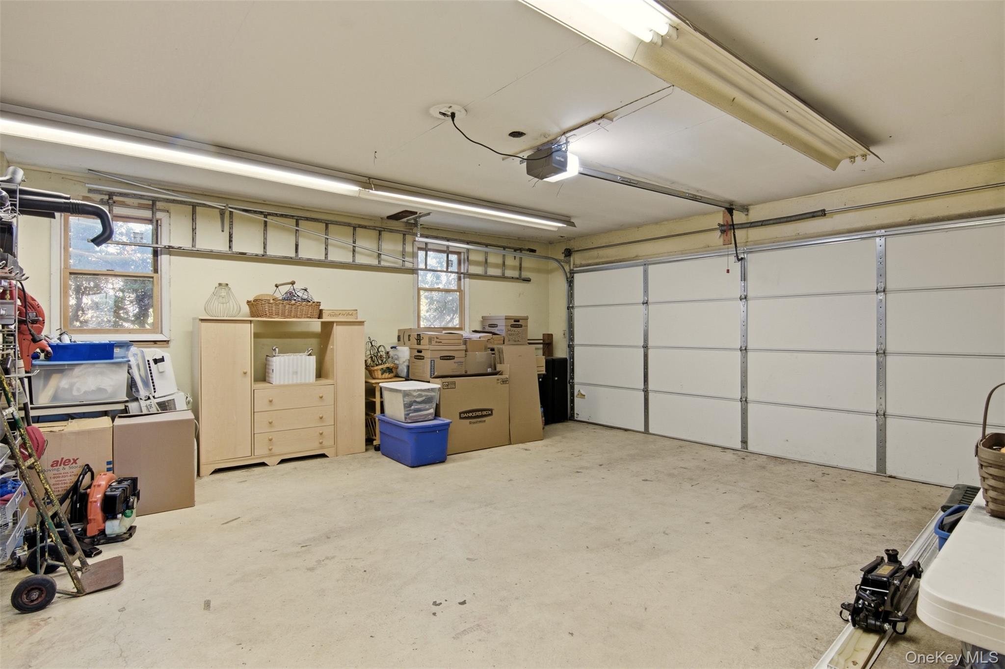 8 Old Wood Road Stony Brook, NY 11790 - Photo 22 of 50 Garage with a garage door opener