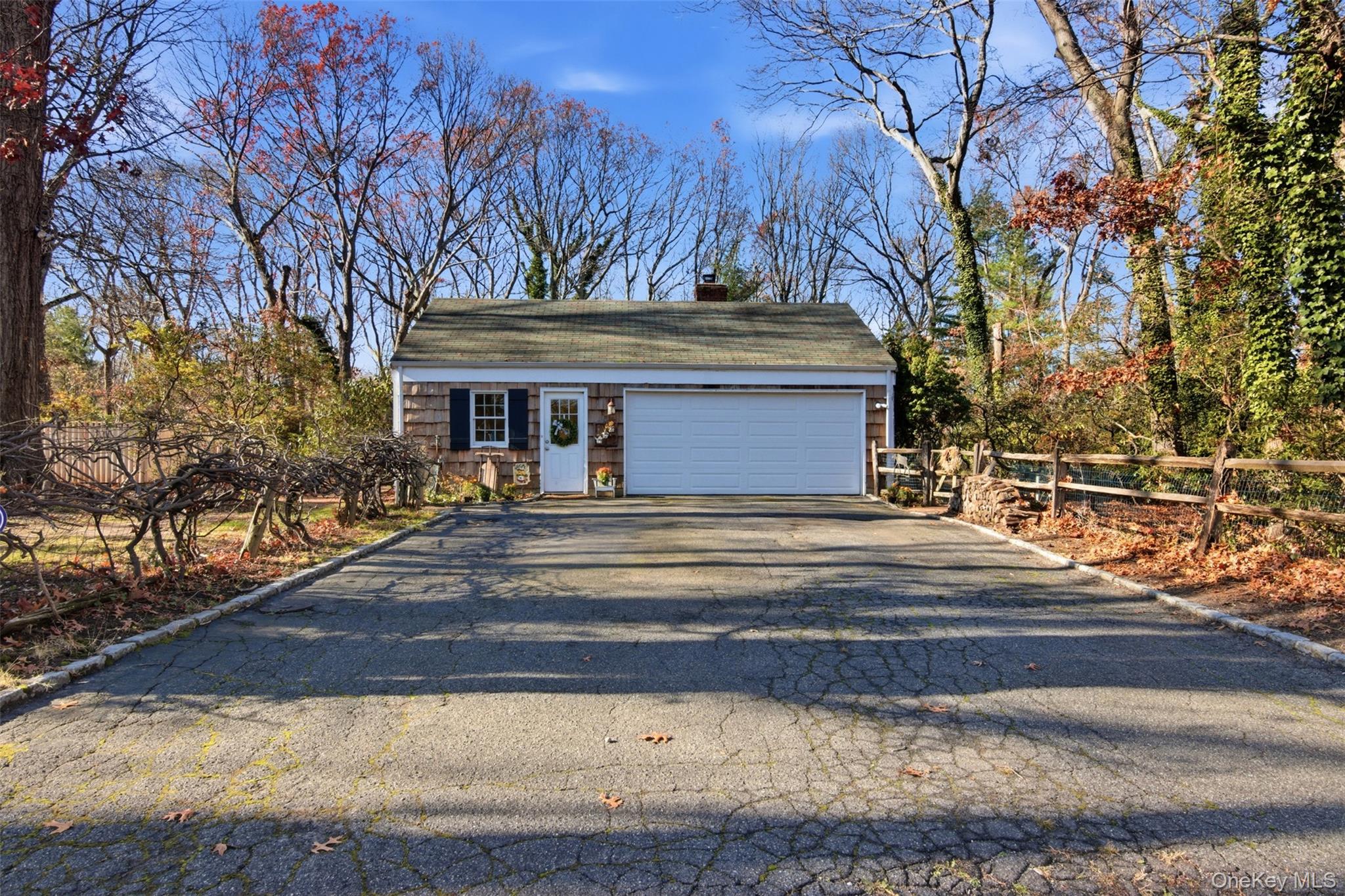 8 Old Wood Road Stony Brook, NY 11790 - Photo 31 of 50 Garage with asphalt driveway