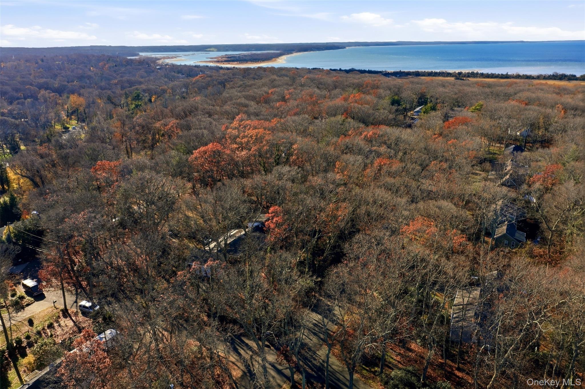 8 Old Wood Road Stony Brook, NY 11790 - Photo 35 of 50 Drone / aerial view of a large body of water and a heavily wooded area