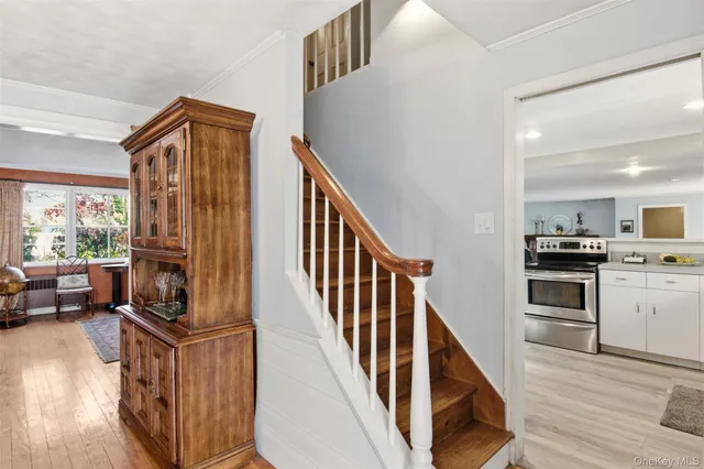 a view of kitchen and entryway with wooden floor