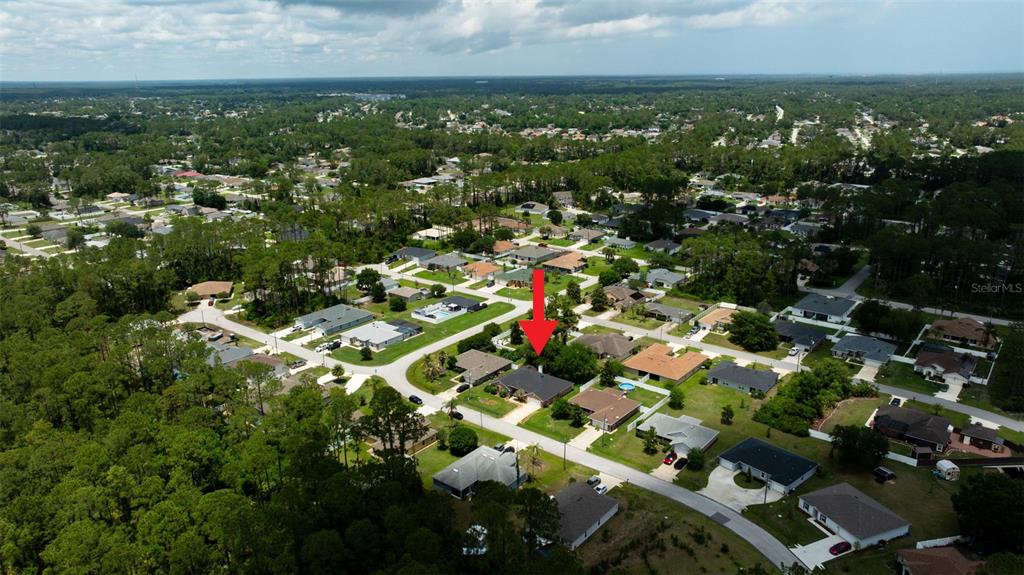 11 Riddle Drive Palm Coast, FL 32164 - Photo 25 of 33 an aerial view of residential houses with city view and lake view