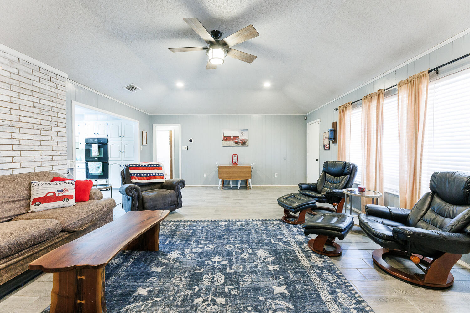 705 Grace Street Brownfield, TX 79316 - Photo 14 of 43 a living room with furniture and a large window