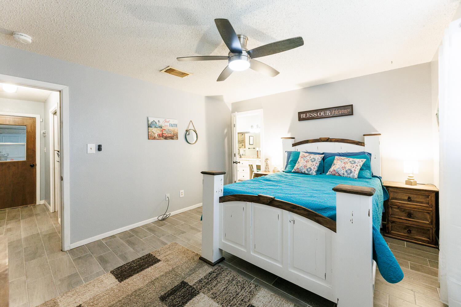 705 Grace Street Brownfield, TX 79316 - Photo 23 of 43 a bedroom with a bed and a dresser