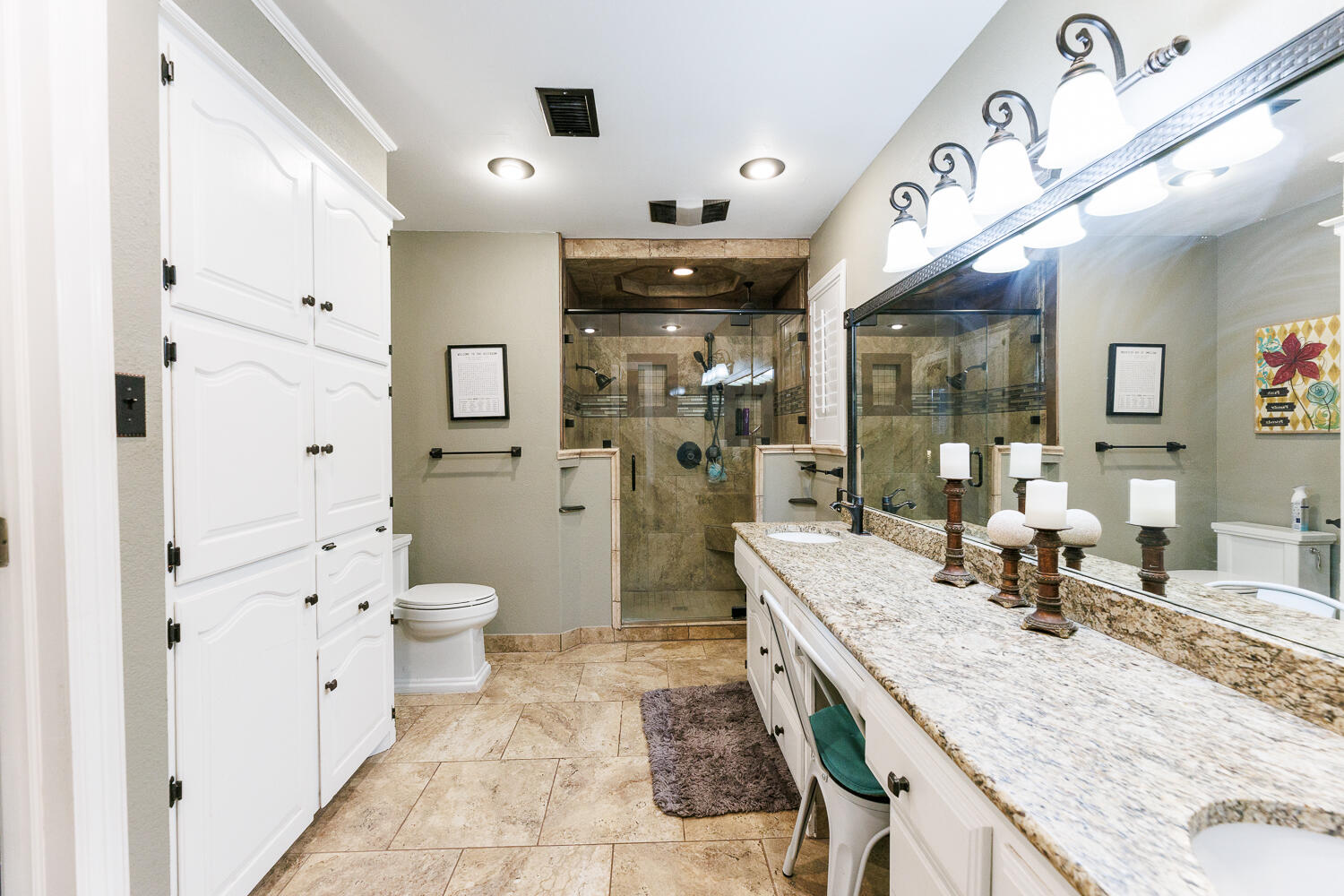 705 Grace Street Brownfield, TX 79316 - Photo 24 of 43 a bathroom with a granite countertop sink and a large mirror