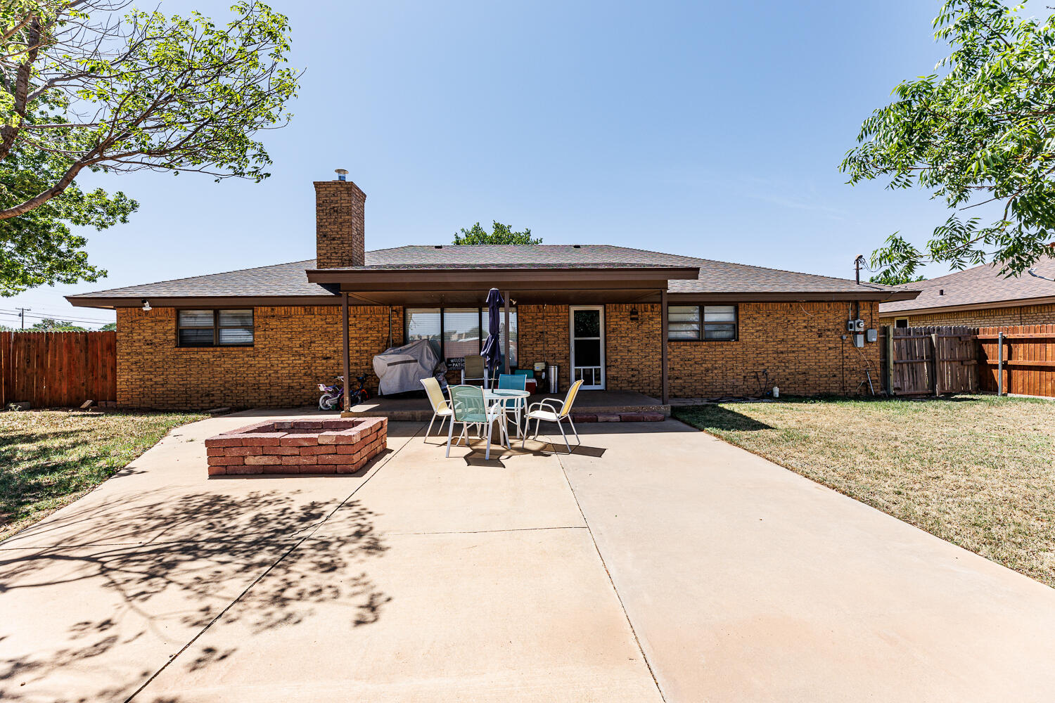 705 Grace Street Brownfield, TX 79316 - Photo 40 of 43 a view of a house with backyard outdoor seating area and furniture