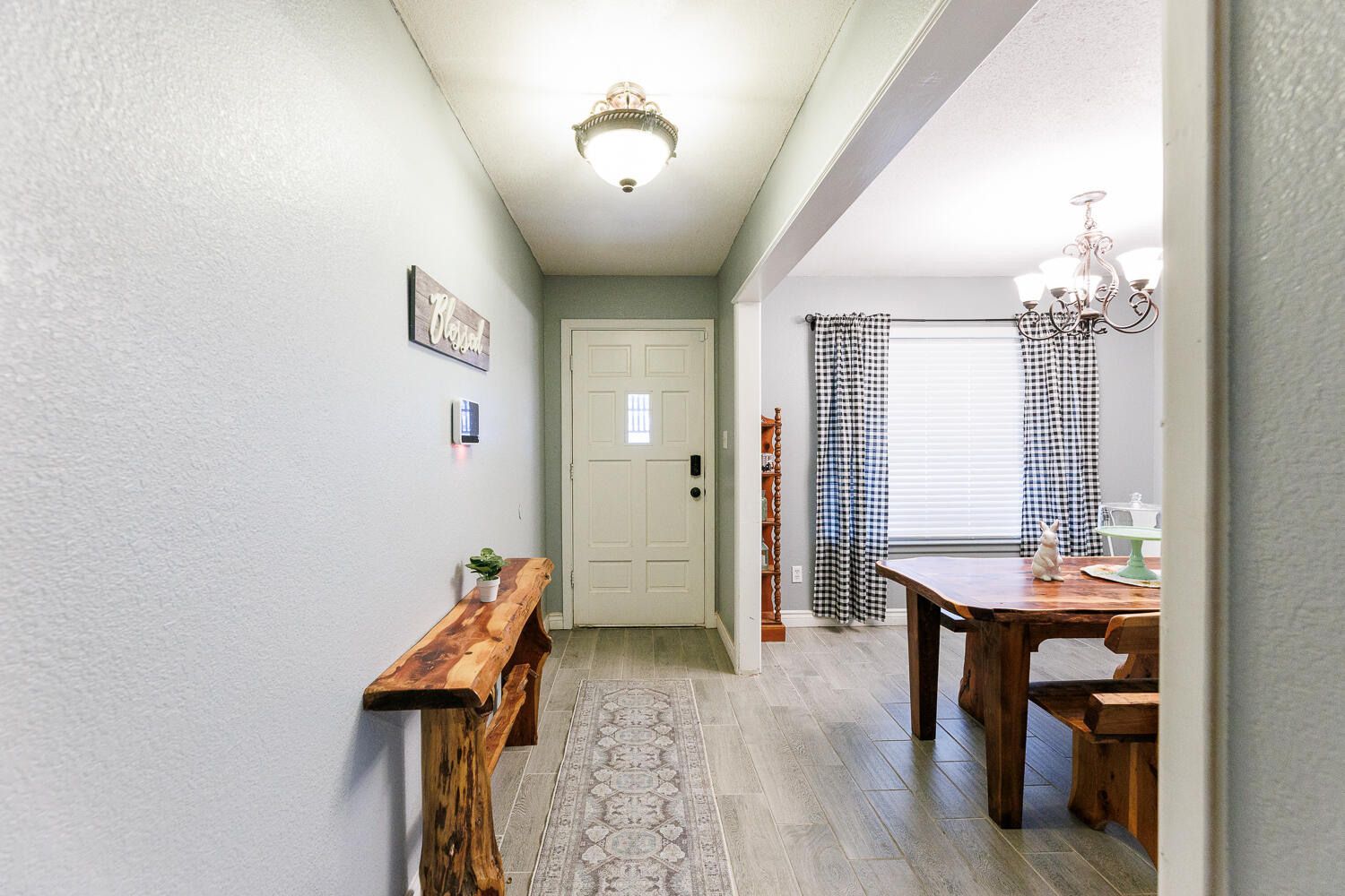 705 Grace Street Brownfield, TX 79316 - Photo 4 of 43 a room with furniture and wooden floor