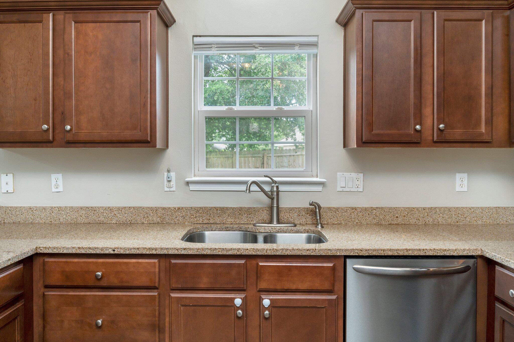 4635 Hermosa Road Crestview, FL 32539 - Photo 11 of 49 a kitchen with a sink cabinets and a window