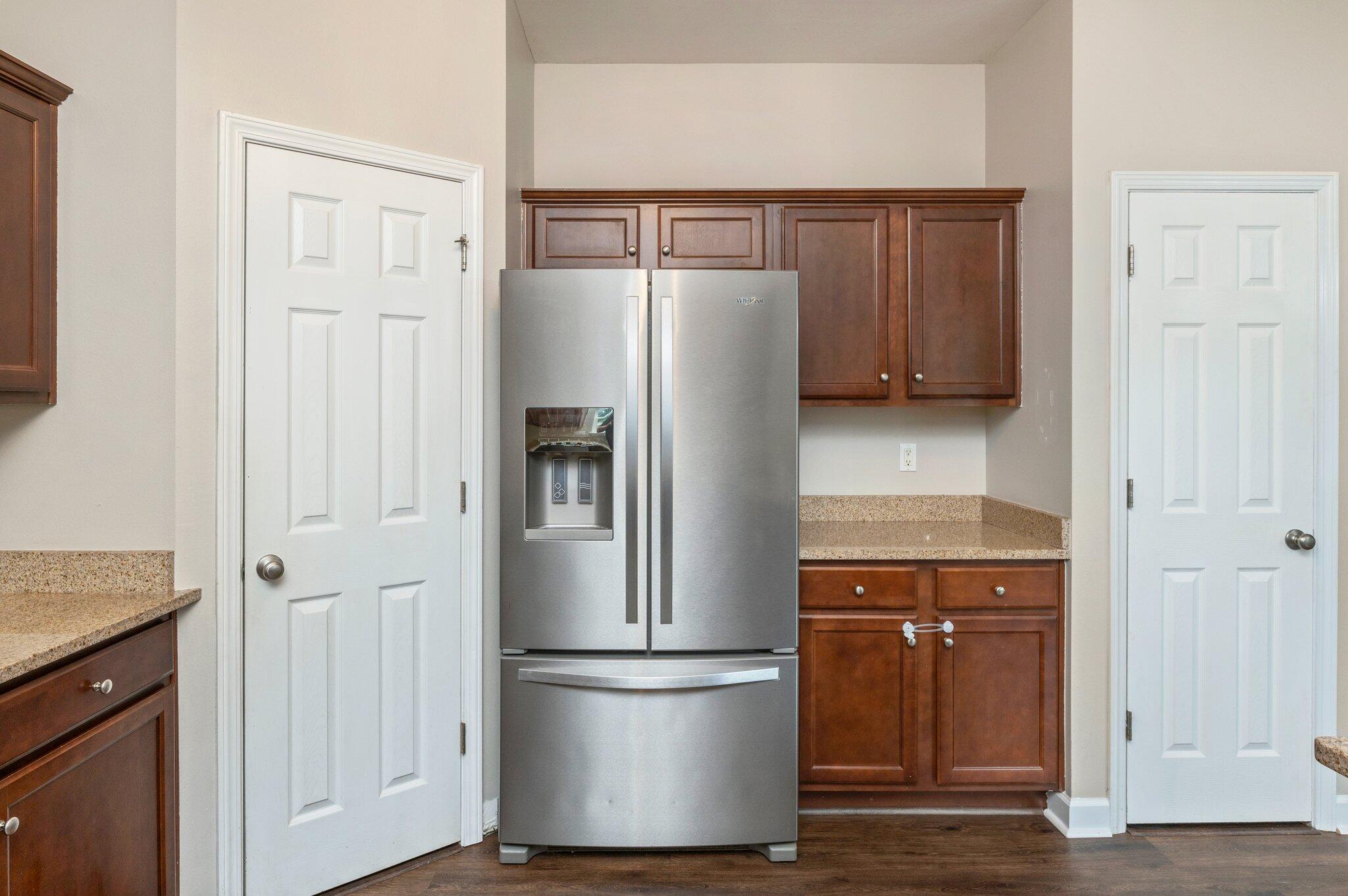 4635 Hermosa Road Crestview, FL 32539 - Photo 13 of 49 a kitchen with metallic refrigerator freezer and a dishwasher