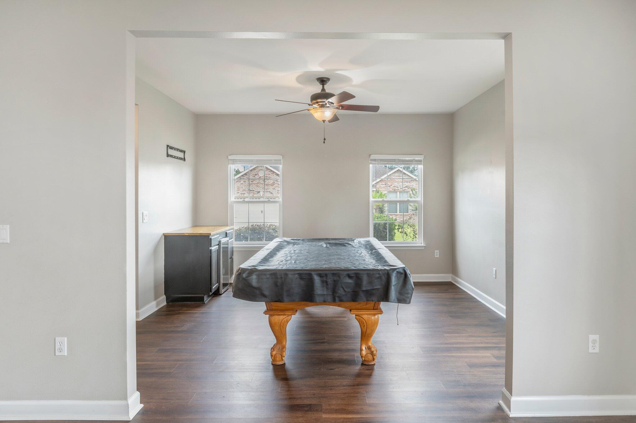 4635 Hermosa Road Crestview, FL 32539 - Photo 19 of 49 a living room with furniture and a chandelier