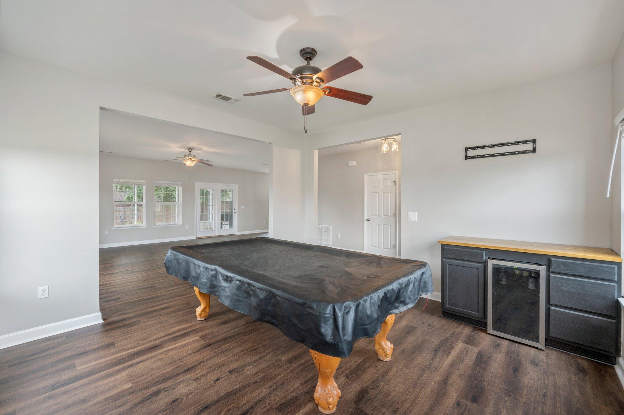 4635 Hermosa Road Crestview, FL 32539 - Photo 21 of 49 a room with wooden floor pool table and window