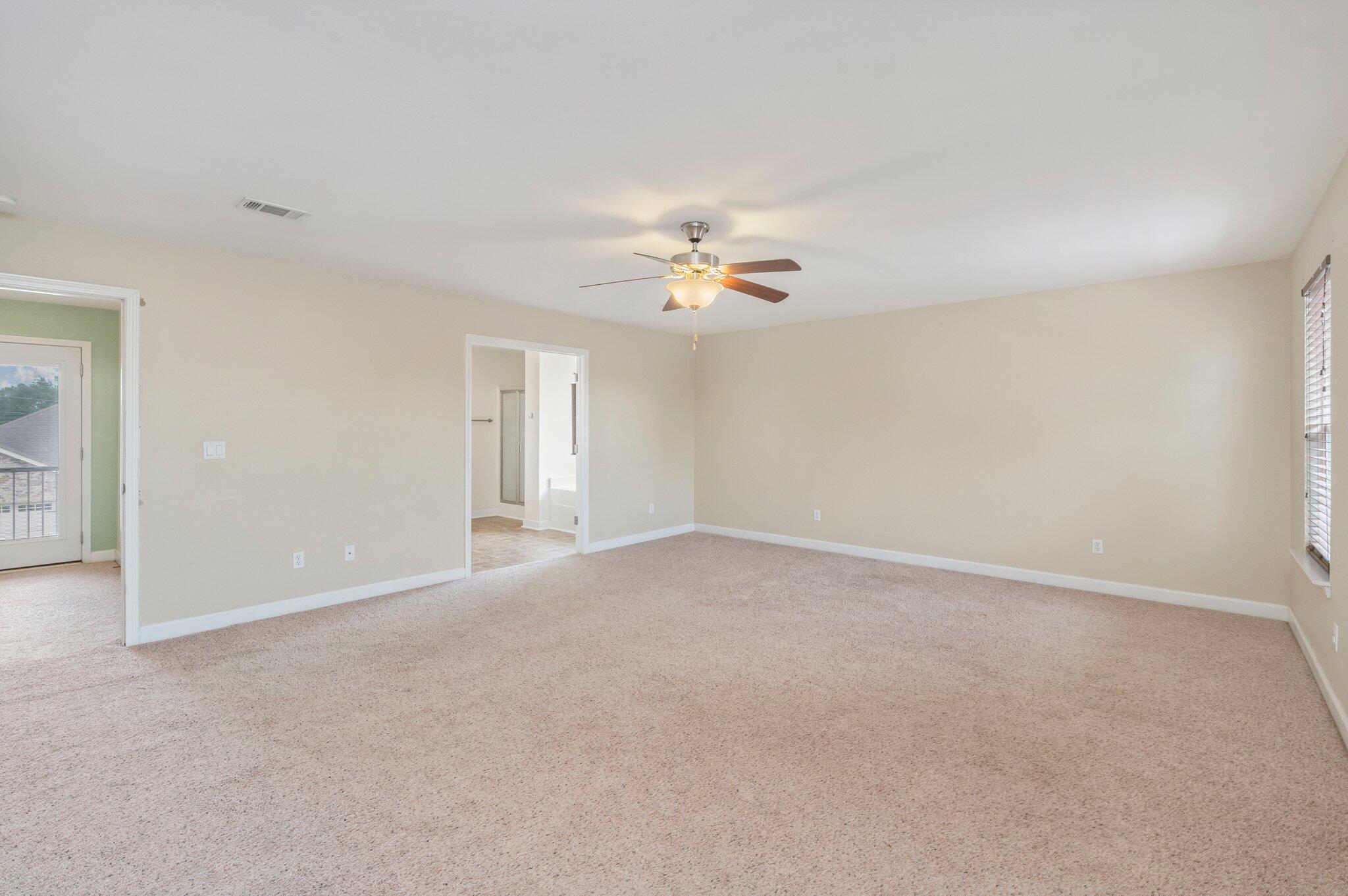 4635 Hermosa Road Crestview, FL 32539 - Photo 34 of 49 a view of a livingroom with a ceiling fan and window