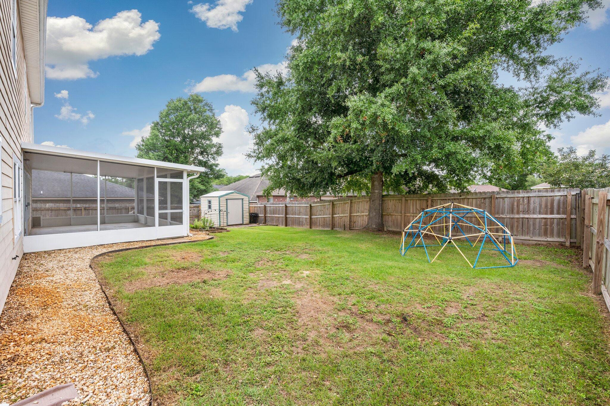 4635 Hermosa Road Crestview, FL 32539 - Photo 41 of 49 a swimming pool with wooden fence