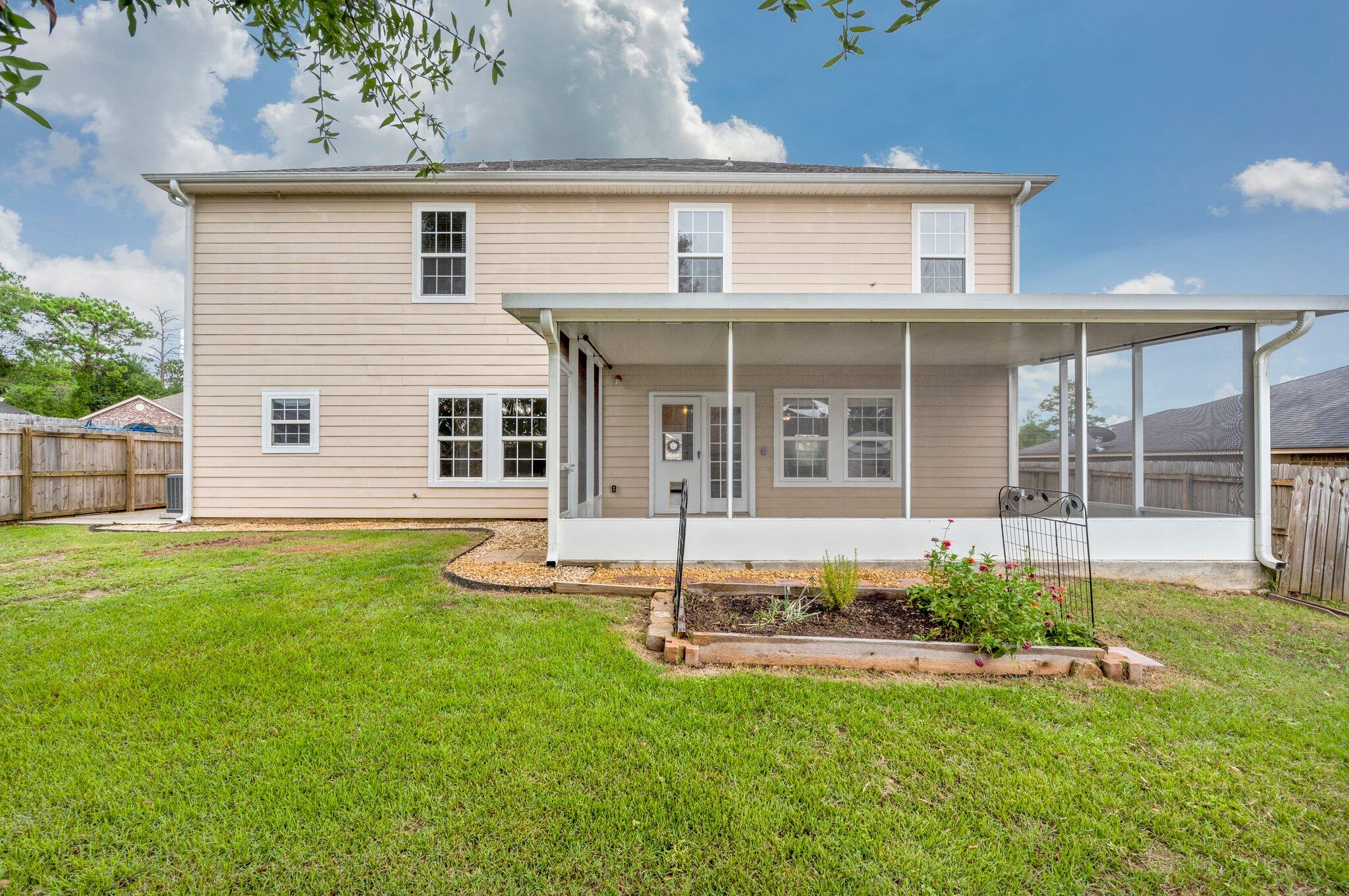 4635 Hermosa Road Crestview, FL 32539 - Photo 44 of 49 front view of a house with a yard