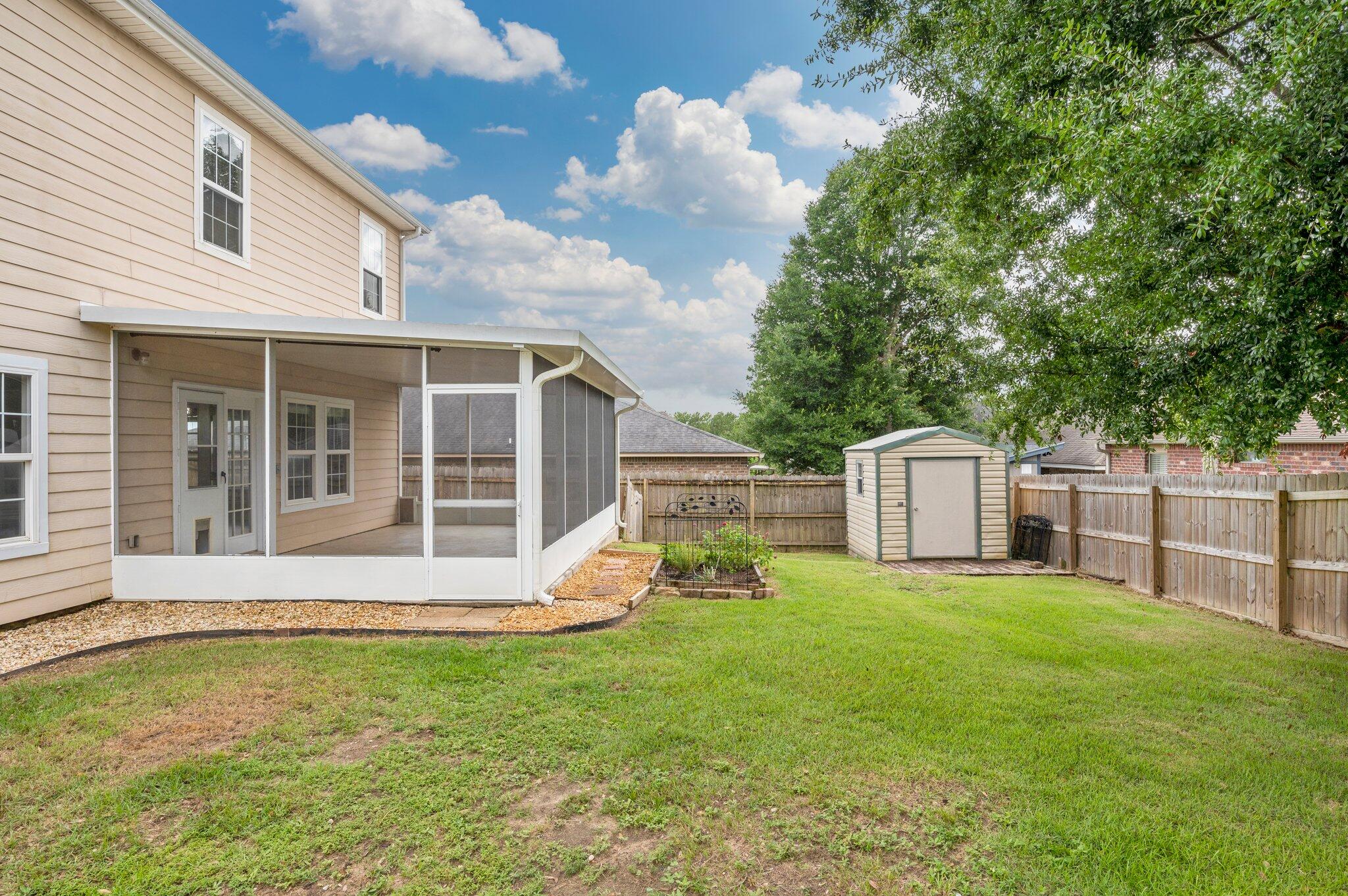 4635 Hermosa Road Crestview, FL 32539 - Photo 45 of 49 a view of a house with a yard and sitting area