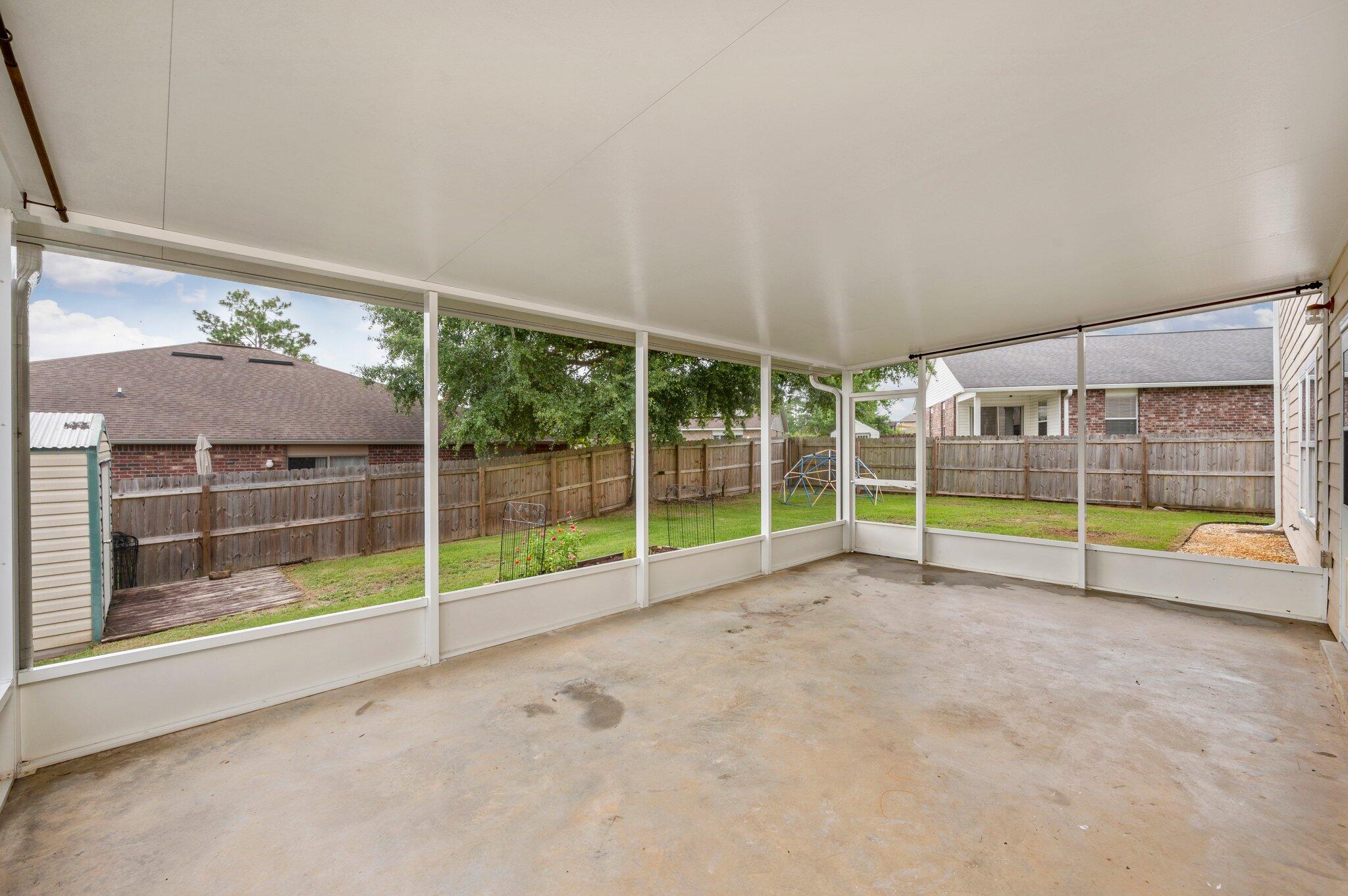 4635 Hermosa Road Crestview, FL 32539 - Photo 47 of 49 a view of an empty room with sliding glass door