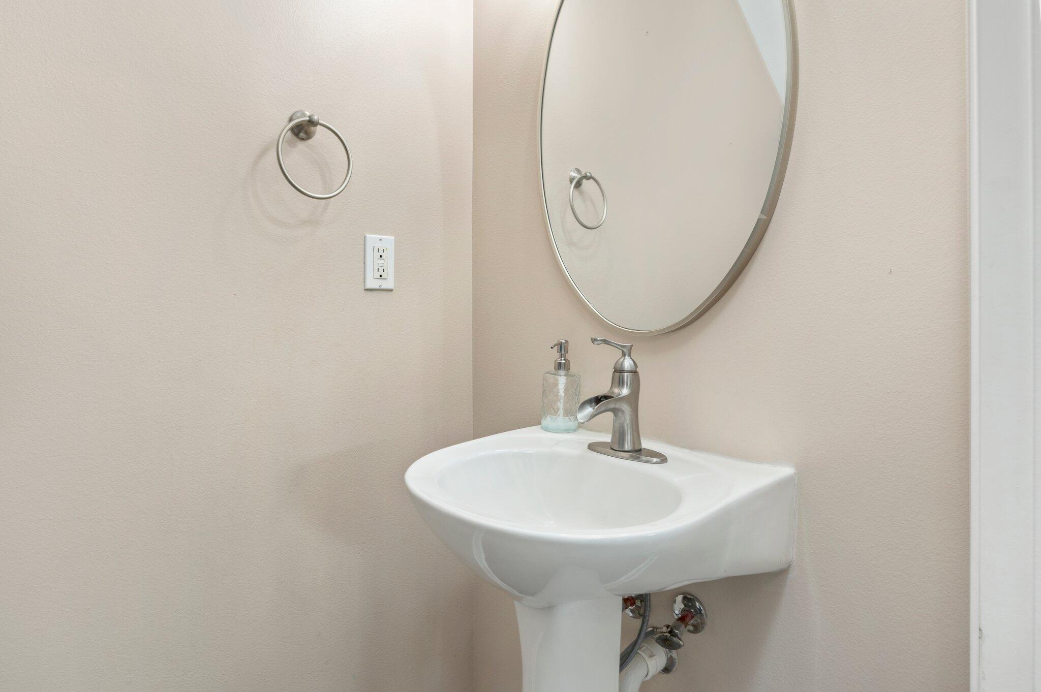 4635 Hermosa Road Crestview, FL 32539 - Photo 6 of 49 a bathroom with a sink and a mirror