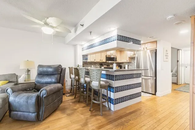 a living room with furniture or couch and a large window