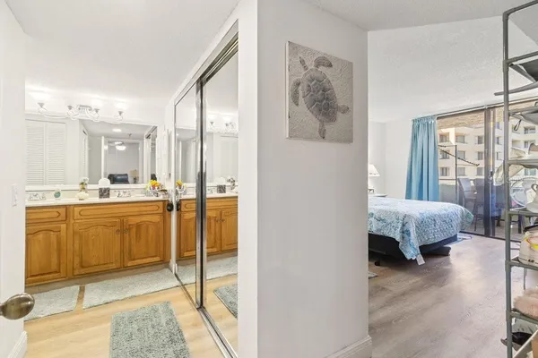 a bathroom with a sink vanity and a mirror
