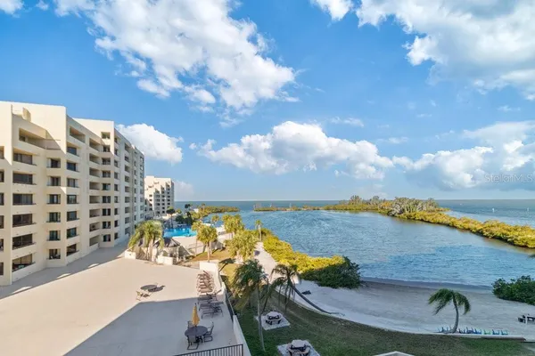 a view of an ocean with a floor to ceiling window