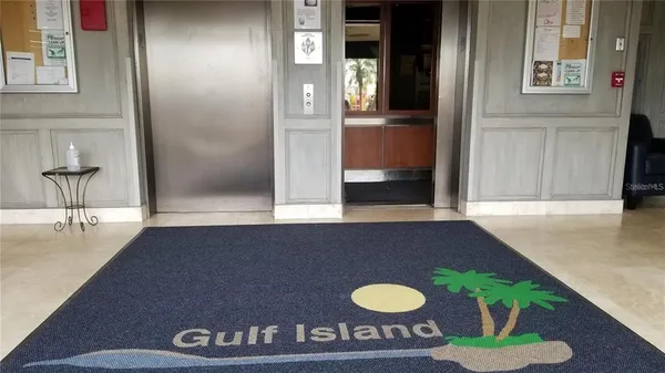 a living room with furniture and a gate