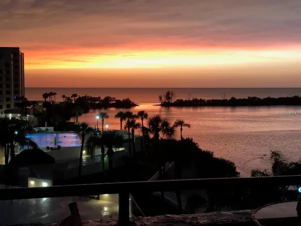 a view of parking garage with cars