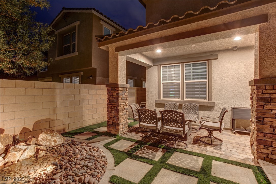 8099 Rams Collide Street Las Vegas, NV 89166 - Photo 12 of 72 Patio at twilight featuring a patio and outdoor dining space