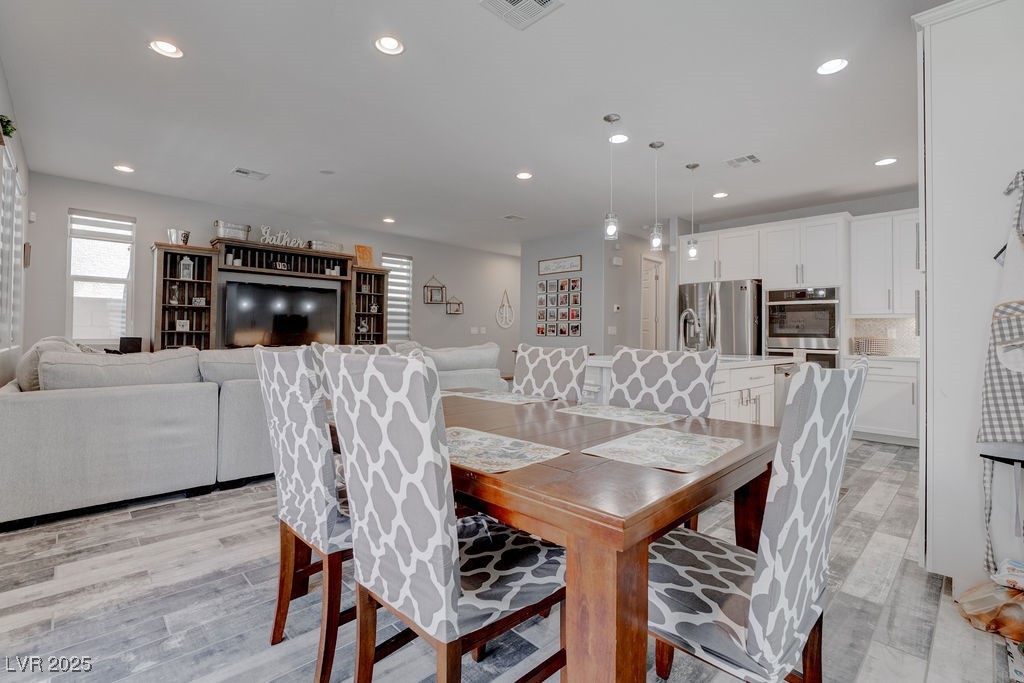 8099 Rams Collide Street Las Vegas, NV 89166 - Photo 23 of 72 Dining space featuring recessed lighting and light wood finished floors