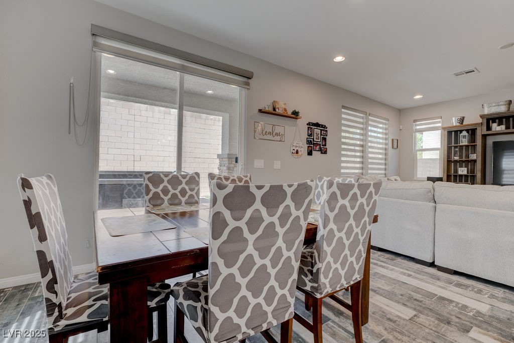 8099 Rams Collide Street Las Vegas, NV 89166 - Photo 24 of 72 Dining area featuring light wood-type flooring and recessed lighting
