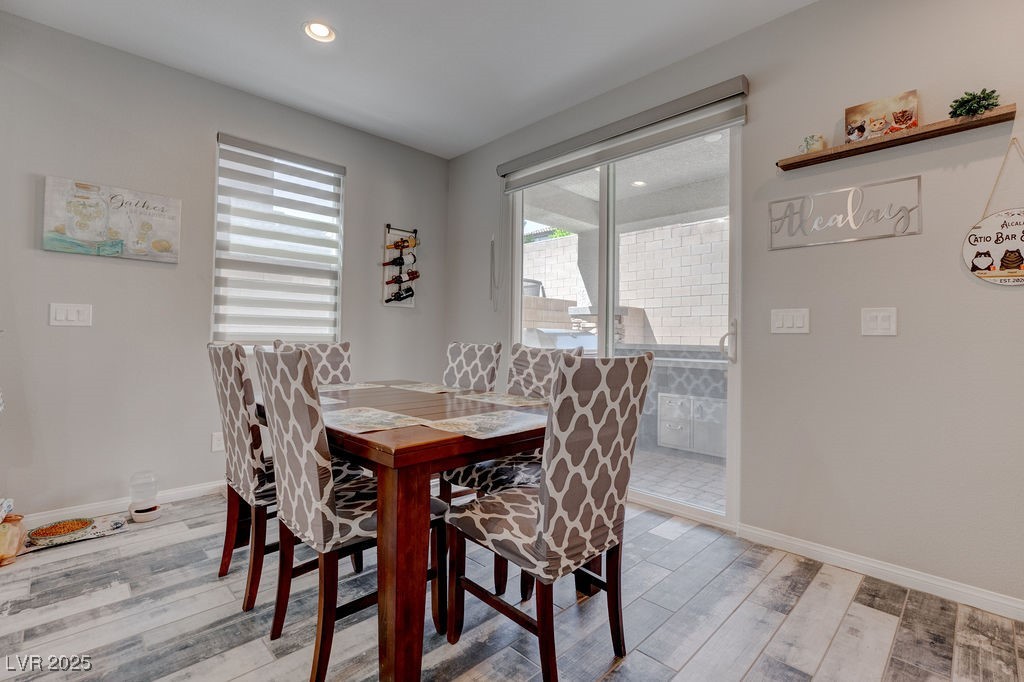 8099 Rams Collide Street Las Vegas, NV 89166 - Photo 25 of 72 Dining area featuring light wood-style flooring and recessed lighting