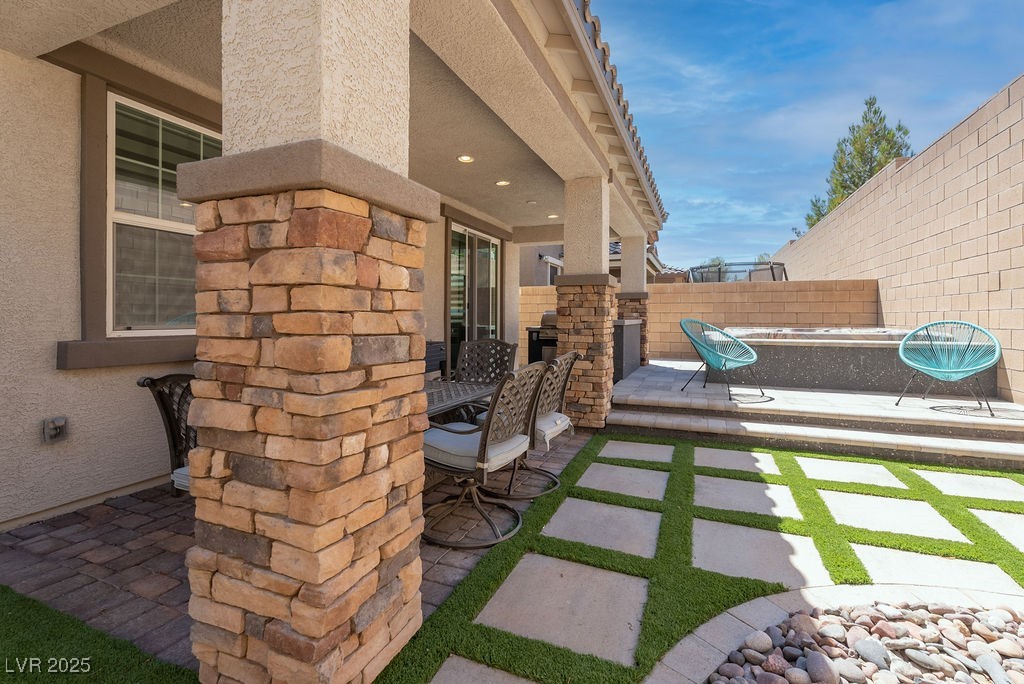 8099 Rams Collide Street Las Vegas, NV 89166 - Photo 29 of 72 Fenced backyard with a patio area