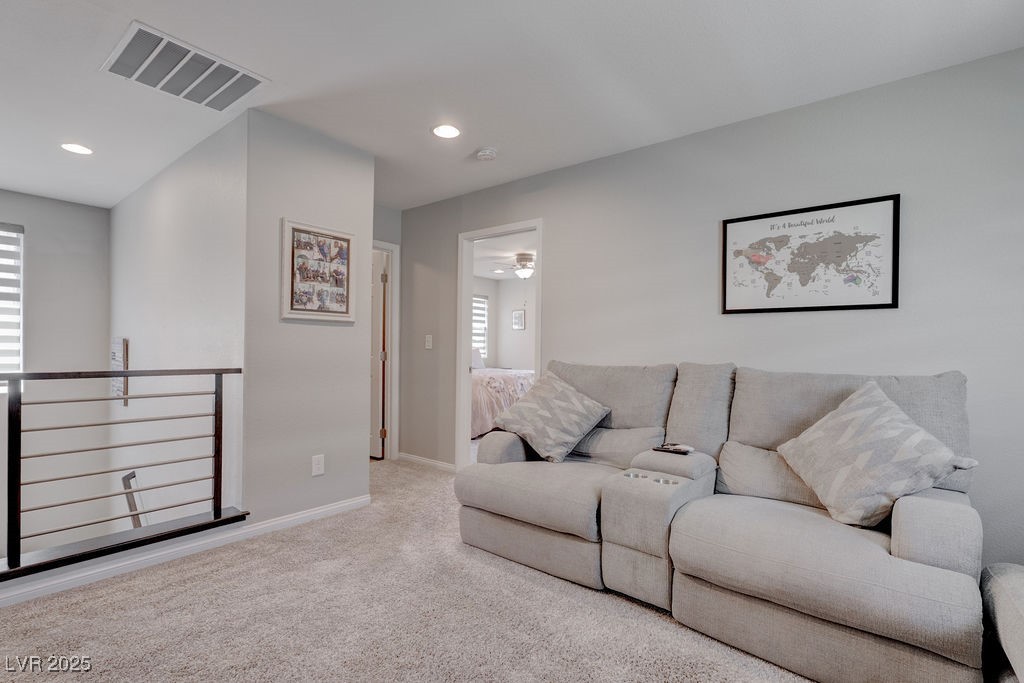 8099 Rams Collide Street Las Vegas, NV 89166 - Photo 45 of 72 Living room featuring light colored carpet, recessed lighting, and a ceiling fan
