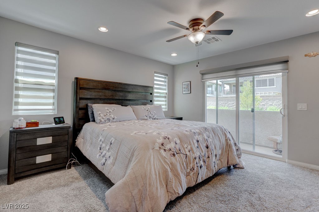 8099 Rams Collide Street Las Vegas, NV 89166 - Photo 48 of 72 Bedroom with multiple windows, carpet floors, access to exterior, and recessed lighting
