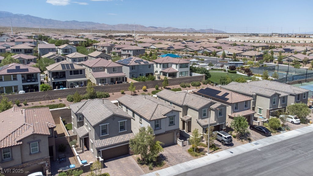 8099 Rams Collide Street Las Vegas, NV 89166 - Photo 55 of 72 Aerial view of residential area with mountains