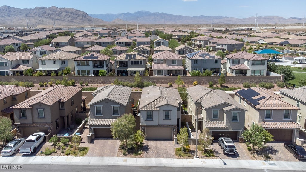 8099 Rams Collide Street Las Vegas, NV 89166 - Photo 56 of 72 Aerial view of residential area with a mountainous background