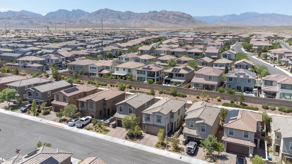 8099 Rams Collide Street Las Vegas, NV 89166 - Photo 58 of 72 Aerial view of residential area with mountains