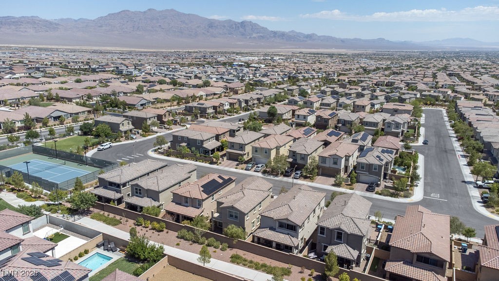 8099 Rams Collide Street Las Vegas, NV 89166 - Photo 62 of 72 Aerial view of residential area featuring a mountainous background
