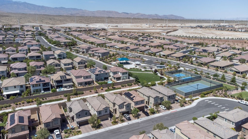8099 Rams Collide Street Las Vegas, NV 89166 - Photo 64 of 72 Aerial perspective of suburban area featuring a mountain backdrop