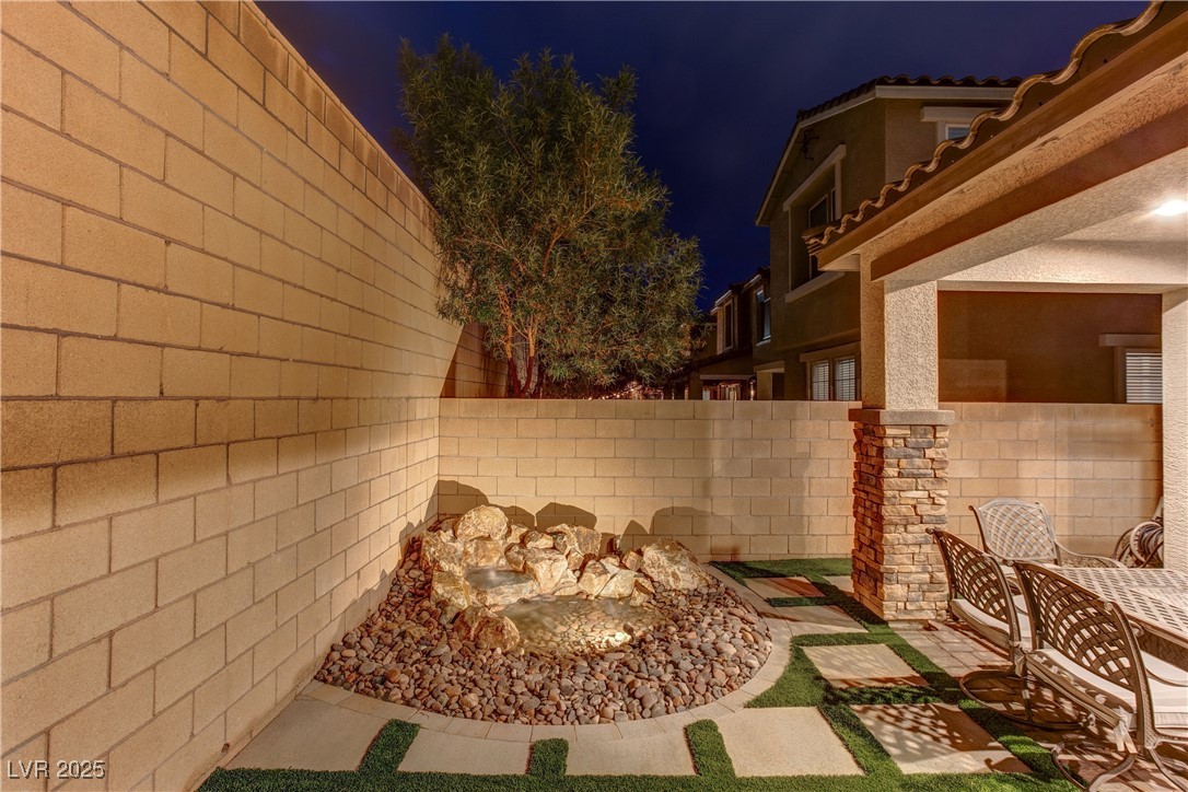 8099 Rams Collide Street Las Vegas, NV 89166 - Photo 69 of 72 Patio at twilight with a patio