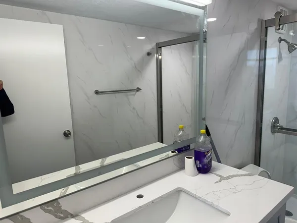 a bathroom with a sink and a shower