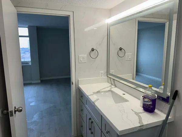 a bathroom with a sink and a mirror