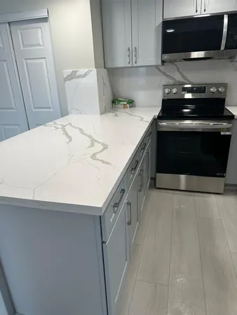 a kitchen with a stove and a microwave