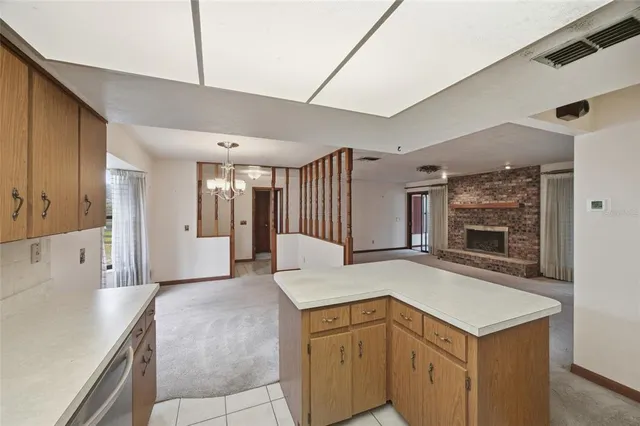 a view of living room with granite countertop furniture and fireplace