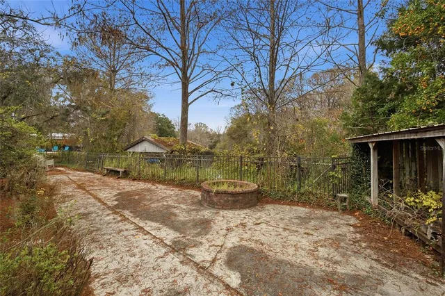 a blue and white house with a outdoor space