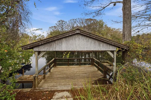 a view of a balcony with wooden floor