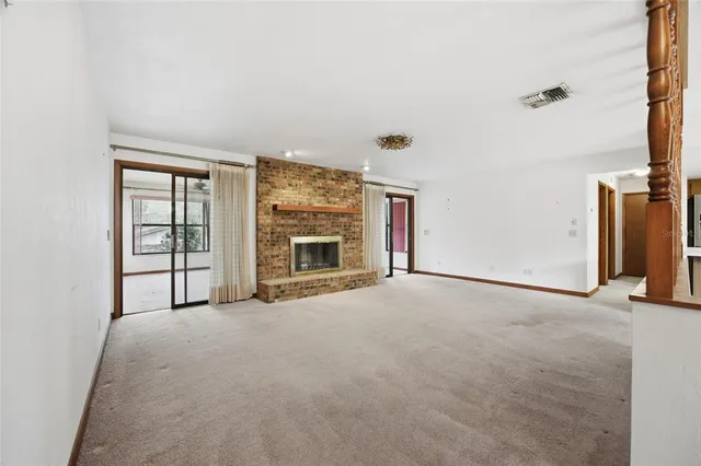 an empty room with fireplace