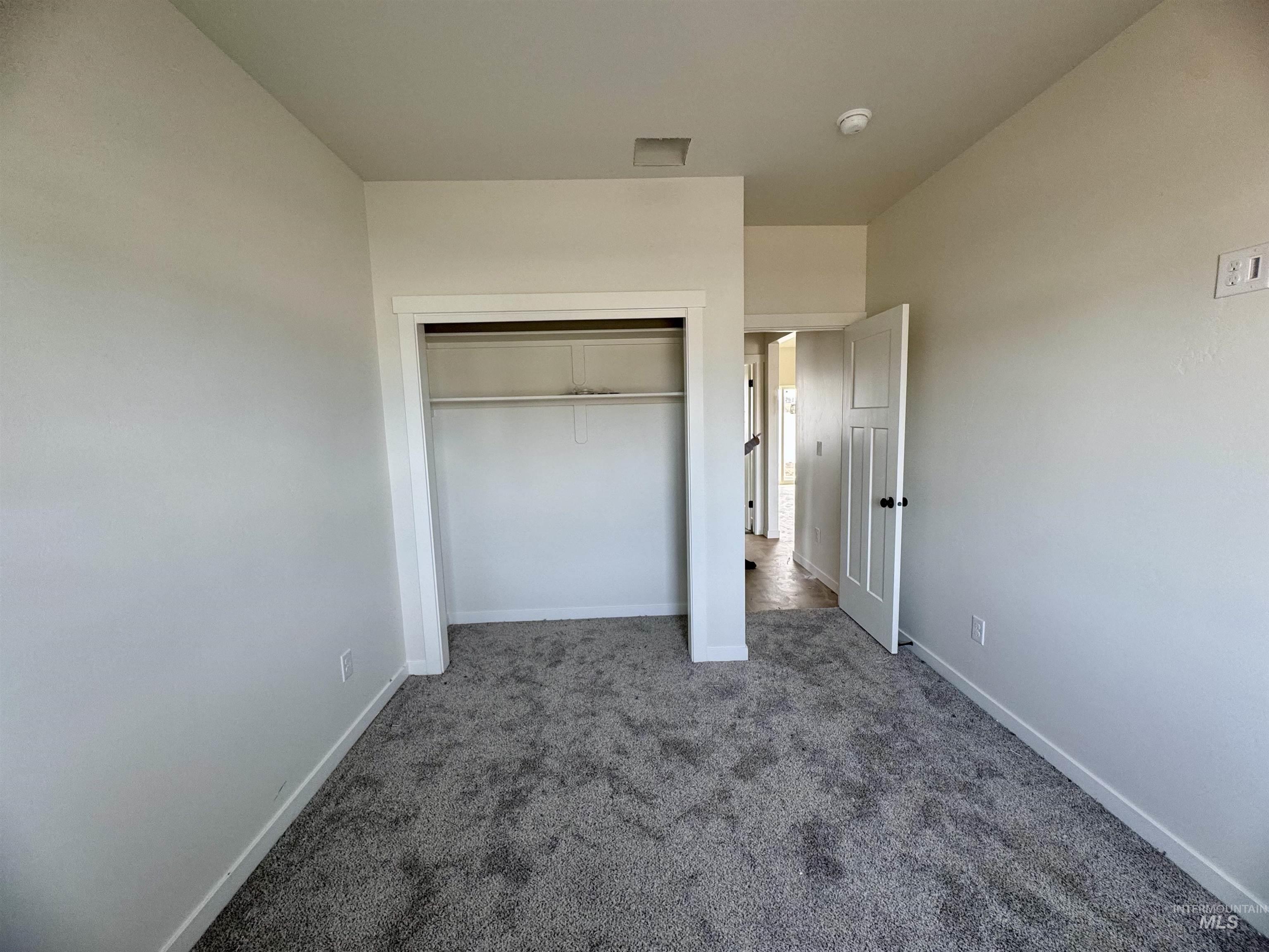 2014 Regan Street Jerome, ID 83338 - Photo 12 of 15 Unfurnished bedroom with carpet flooring and a closet