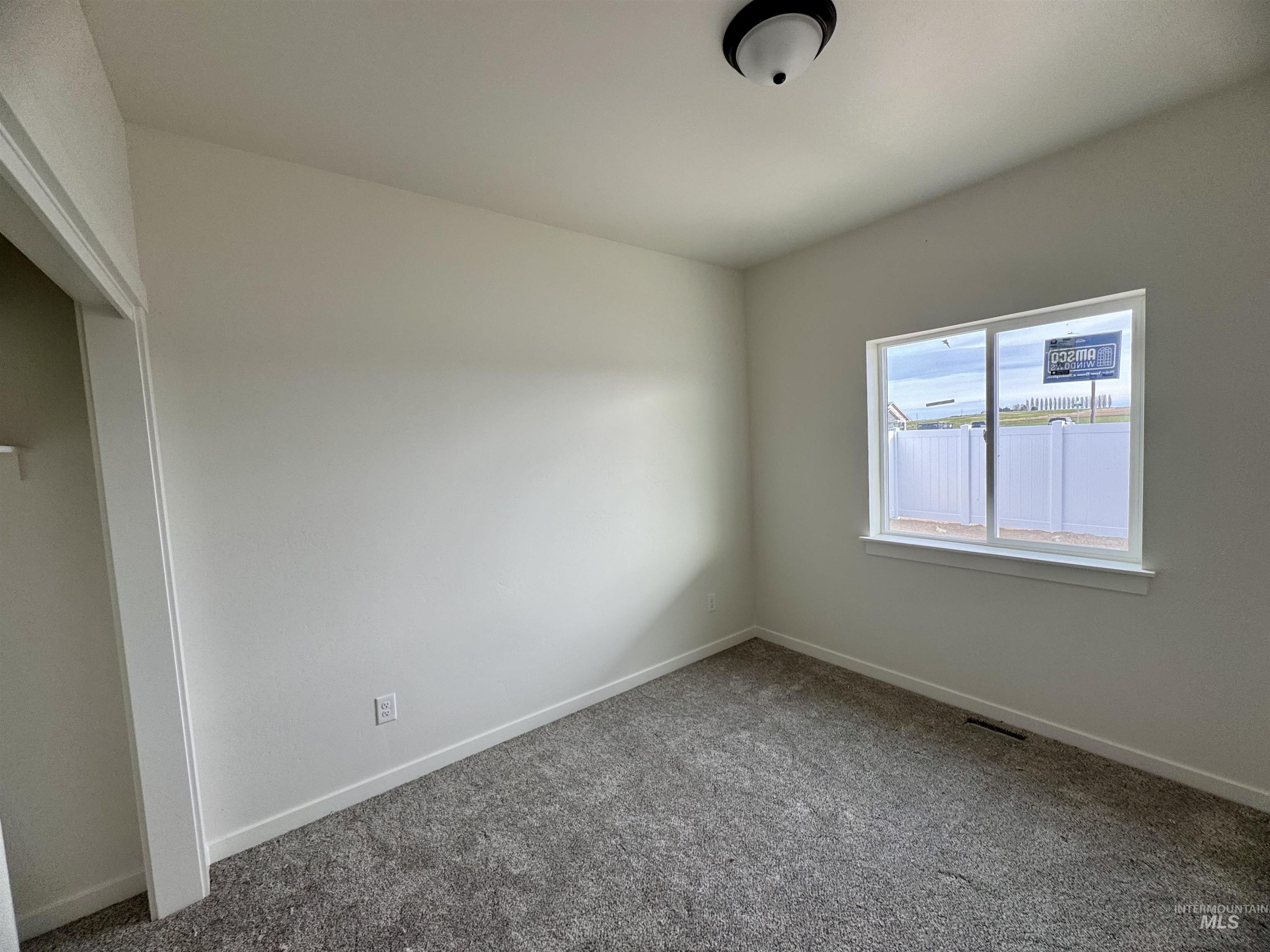 2014 Regan Street Jerome, ID 83338 - Photo 9 of 15 Carpeted spare room with baseboards